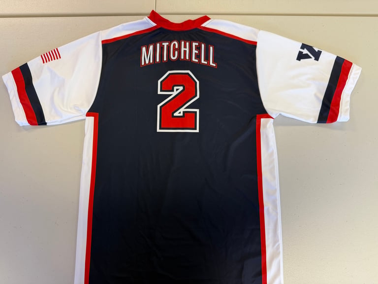 Back view of Mitchell number 2 basketball jersey in navy blue, white, and red