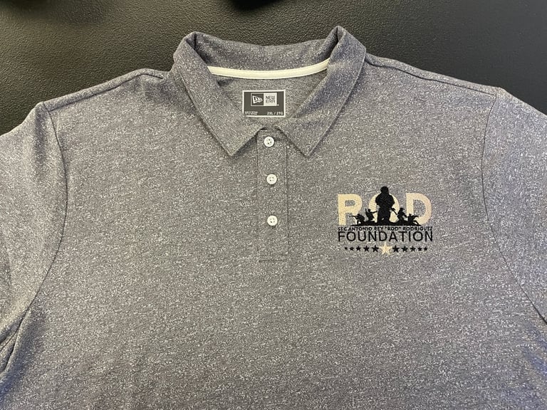 Gray polo shirt with RADD Foundation logo embroidered on chest